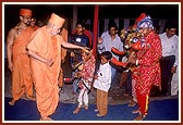 Swamishri blesses a tribal child&nbsp;