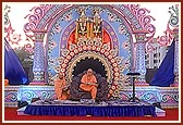 Festival celebration of Yogiji Maharaj's 111th birthday anniversary. The beautiful backdrop stage with Thakorji and Swamishri during the celebration assembly &nbsp;