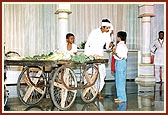 A skit shows a vegetable vendor with a message during an evening assembly