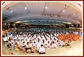 Sadhus and devotees during the evening assembly in 'Pramukh Swami Auditorium'