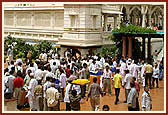 Devotees enjoy the prasad served in the mandir precincts after the Rakshabandhan assembly