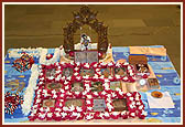 Shri Harikrishna Maharaj adorned on a swing during Swamishri's puja