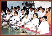 Balaks sing bhajans during puja