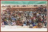 Some of the female devotees seated in the open assembly hall during the Rakshabandhan assembly