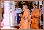 Engaged in darshan of deities