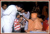 Swamishri individually blesses and consoles the relatives of those who had died