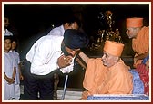 Swamishri individually blesses and consoles the relatives of those who had died