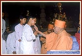 Swamishri individually blesses and consoles the relatives of those who had died