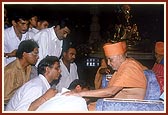 Swamishri individually blesses and consoles the relatives of those who had died