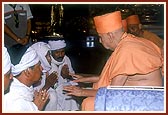 Swamishri individually blesses and consoles the relatives of those who had died