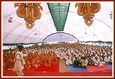 Sadhus and devotees listen to the discourses in the 'Yagnapurush Mandapam'