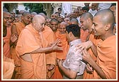 Swamishri blesses an amused Suresh and then talks to him