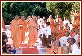 Swamishri talks to and blesses students who study at Pramukh Swami Vidya Mandir in Sarangpur 