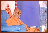 Swamishri seated in the public assembly