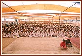 Devotees seated in the murti pratishtha assembly