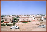 The BAPS-reconstructed village of Gunatitpur, featuring earthquake-resistant houses, well-planned village layout with trees and courtyards and environment-friendly designs