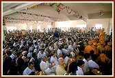 Devotees perform the murti pratishtha arti