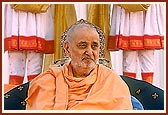 Swamishri seated on stage during the public assembly 