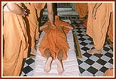 Swamishri prostrates at the mandir built as a memorial to Shriji Maharaj in Laxmivadi