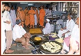 Swamishri sees how the sweet items for Annakut are being prepared