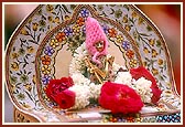 Shri Harikrishna Maharaj donned in woollen clothes to keep Him warm in the winter cold