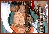 Swamishri sanctifies the musical instruments of a saint who played them while singing kirtans during his morning puja