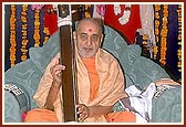 Swamishri sanctifies the musical instruments of a saint who played them while singing kirtans during his morning puja