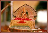 Diksha Ceremony: Swamishri offers rose petals to Shri Harikrishna Maharaj while the Janmangal Namavali - 108 names of Shriji Maharaj - is chanted during the mahapuja