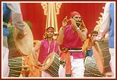 The tribal devotees traditionally dance, sing and play the flute