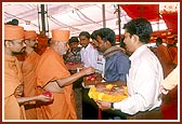 Swamishri performs pujan of bricks brought by devotees for the foundation-stone laying ceremony of their home, shop, etc.