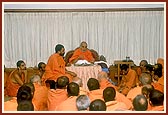Swamishri with sadhus while having breakfast
