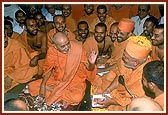 Swamishri sits with the sadhus and rejoices with them