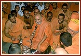 Swamishri sits with the sadhus and rejoices with them