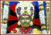 Bhagwan Swaminarayan decked in flowers