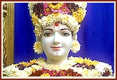 Shri Harikrishna Maharaj decked in flowers