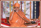 Swamishri blesses a devotee on the phone