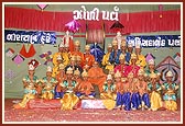 Kishores with Swamishri after performing a traditional dance