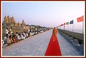 Swamishri takes his routine evening walk in the precincts of the Tithal mandir