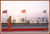 Swamishri takes his routine evening walk in the precincts of the Tithal mandir