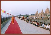 Swamishri takes his routine evening walk in the precincts of the Tithal mandir