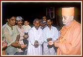 The devotees ritually donate their land for the construction of a mandir