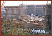 Swamishri and sadhus observe the under construction Akshardham complex