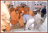 Swamishri blesses Shri Harshad Chavda and site engineer Shri Ashwin Patel who offered their services in building the mandir