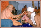 Swamishri initiates Shri Vipul R. Patel of Houston, USA, a graduate of Harvard University and names him as Vyas Bhagat