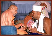 Swamishri initiates Shri Parmanand Y. Jani of Birmingham, USA, a B.S. Computer Science graduate and names him as Kapil Bhagat