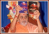 Swamishri inaugurates a new print publication, 'Karma Siddhant and Punarjanma', published by Swaminarayan Aksharpith