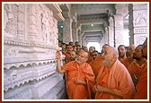 Swamishri engaged in darshan of and offers pranams to the murtis of paramhansas and devotees in the mandir mandovar