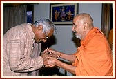 Shri George Fernandes, Defense Minister of India, is blessed by Swamishri