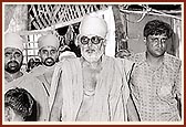 Swamishri on a round of sanctifying houses in Dhuliya