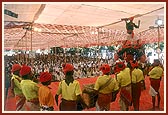 Tribal devotees perform a traditional dance 